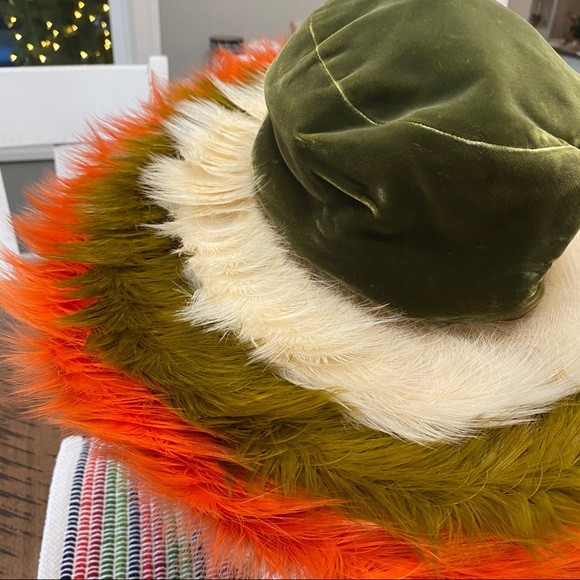 Styled by Jack McConnell feather orange, white, and green hat vintage unique